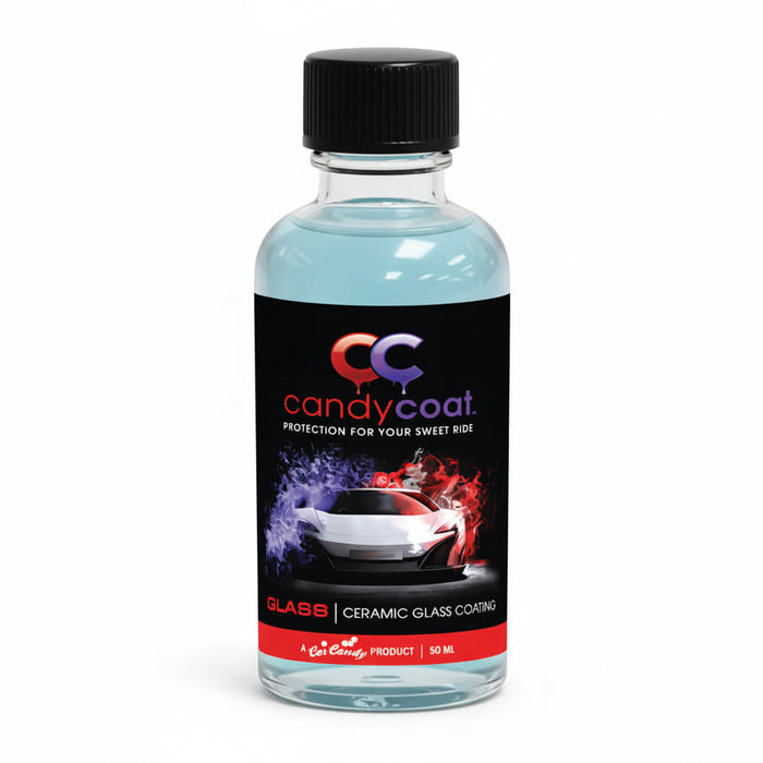 Bottle of candy coat product with black cap on a white background