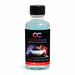 Bottle of candy coat product with black cap on a white background